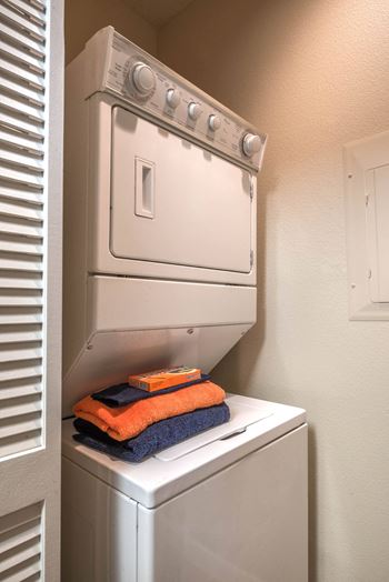 a washer and dryer in a small laundry room